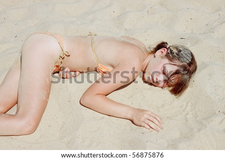 Girl gets heat stroke and lay on the sand