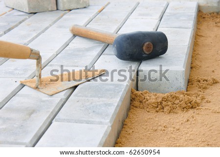 Stone blocks laying down on sand