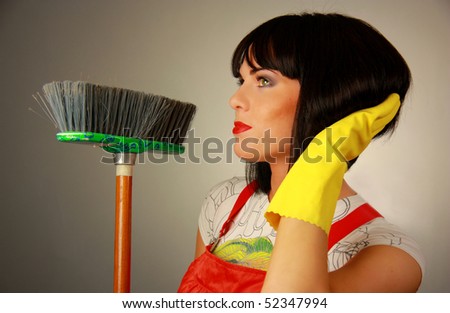 Beautiful Housewife with Broom