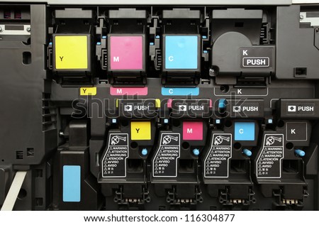close-up shot of a CMYK ink cartridges for laser copier machine