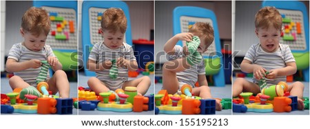 A funny baby boy trying to dress socks in children\'s room