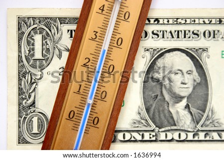 one dollar and thermometer in closeup, stability