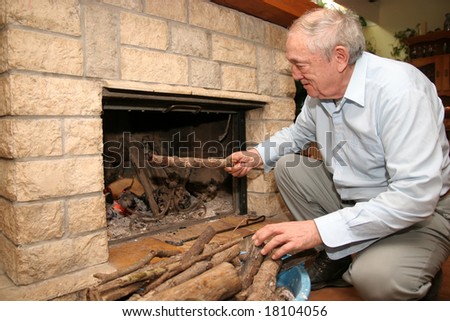 man beside fireplace in