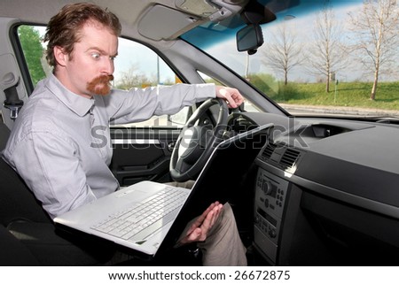 driver using gps laptop computer in a car