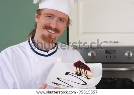 Young chef with piece of cake with chocolate sauce