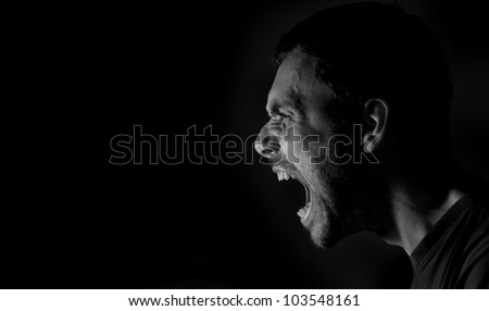 Side portrait of a shouting man