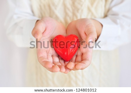 Holding heart in hands