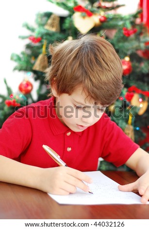 6 year old boy writing a letter to Santa