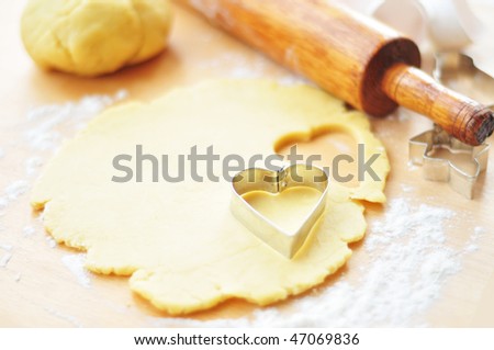 Rolled out cookie dough on a wooden surface