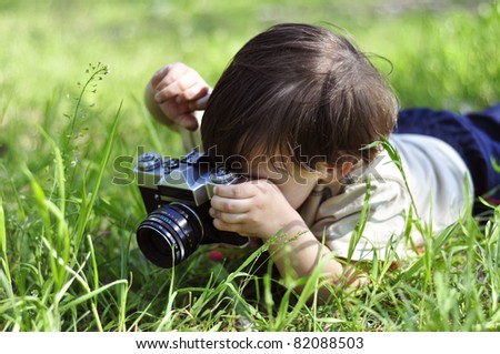 Boy with vintage film camera