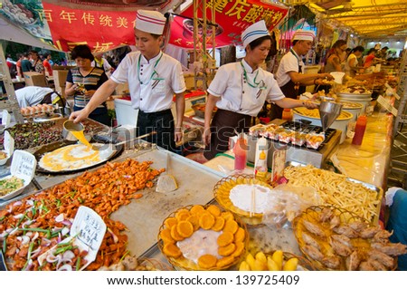 FOSHAN CITY Ã¢Â?Â? MAY 23: Foshan City in 2013 food festival held at Xiqiao Plaza, 100 restaurants to participate in the activities, people have to buy and food taste like May 23, 2013 in Foshan, China