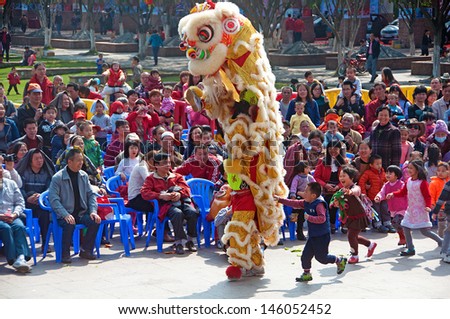 FOSHAN CITY - FEB 23: Foshan City people celebrate the Chinese new year, is the lion dance in the square in front of the ancient temple February 23, 2013 in Foshan, China