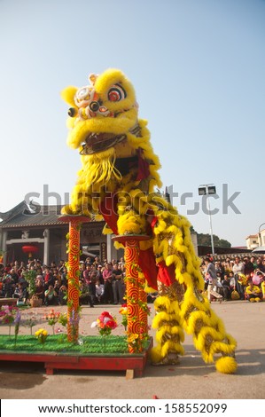 FOSHAN CITY - FEB 21: Foshan City people celebrate the Chinese new year, is the lion dance in the square in front of the ancient temple February 21, 2013 in Foshan, China