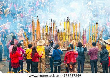 FOSHAN, CHINA - FEB 25, 2014:Legend year today a Buddism godness Guanyin open warehouse, giving people, Buddhist believers to pray and hope to borrow money, great luck in making money