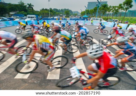 Foshana, China - June 22: In order to encourage citizens to exercise, Sports Bureau organized cycling competition, more than 600 people attended, June 22, 2014 in Foshan, China.