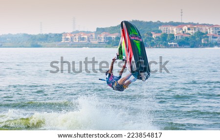 FOSHAN - Sep 29:In order to celebrate the arrival of the October 1 National Day, the motorcycle clippers in foshan lake show, wonderful sports attract all. Cheers Sep 29, 2014 in Foshan, China