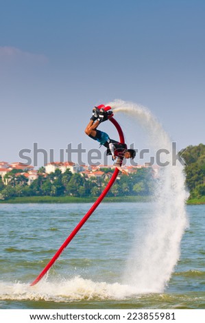FOSHAN - Sep 29:In order to celebrate the arrival of the National Day, water stunt team in foshan lake show, great reversal movement attracted thousands of people watched Sep 29, 2014 in Foshan, China