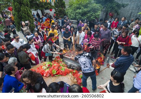 FOSHAN  Feb 27:Ninth day of the Chinese New Year, people worship offering a stone, the legend that sit on the stone can let want to pregnant women with children Feb 27, 2015 in Foshan, China