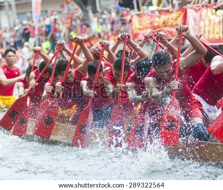FOSHAN-June 21:The Dragon Boat Festival dragon boat in Fen rivers, there are 17 dragon boat teams took part in the game, attracted tens of thousands of people watched June 21, 2015 in Foshan, China