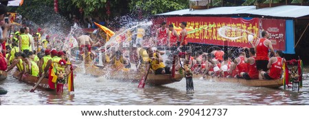 FOSHAN-June 23:The Dragon Boat Festival dragon boat race, the athletes on the river water play each other, having a great time June 23, 2015 in Foshan, China