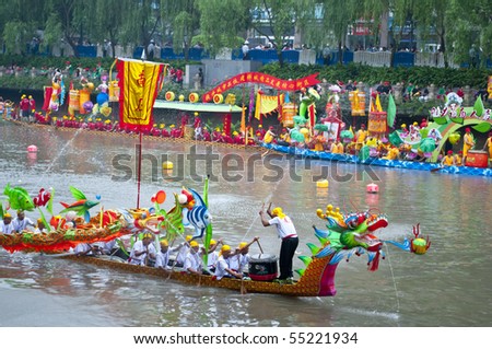 FOSHAN CITY, CHINA - JUNE 12: Participants In Action At FenJiang River Dragon Boat Race June 12, 2010 in Foshan City, China