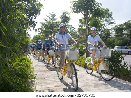 FOSHAN CITY, CHINA– AUGUST 13: Foshan Municipal Government organized bicycle parade promoting green traveling on August 13, 2011 in Foshan City, China