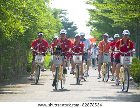 FOSHAN CITY, CHINA – AUGUST 13: Foshan Municipal Government organized bicycle parade promoting green traveling on August 13, 2011 in Foshan City, China