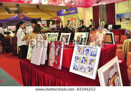 FOSHAN–AUGUST 20:Fall Wedding Expo 2011 at FoShan Stadium On August 20, 2011 in FoShan, China. More than 100 wedding photography, production planning companies took part.