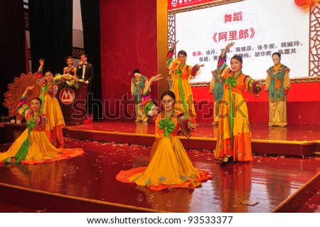 FOSHAN CITY - JANUARY 18: Merchants Bank Employees Dressed In Traditional Korean Costumes On Stage In New Year's Party To Celebrate The Arrival Of Chinese New Year January 18, 2012 in Foshan, China