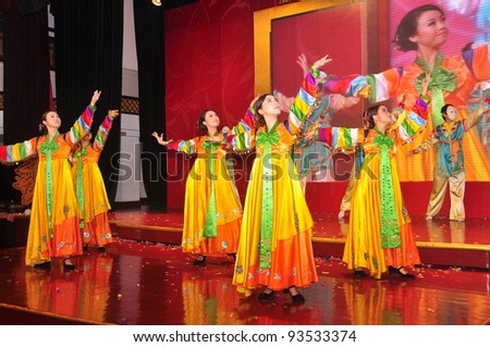 FOSHAN CITY - JANUARY 18: Merchants Bank Employees Dressed In Traditional Korean Costumes On Stage In New Year\'s Party To Celebrate The Arrival Of Chinese New Year January 18, 2012 in Foshan, China