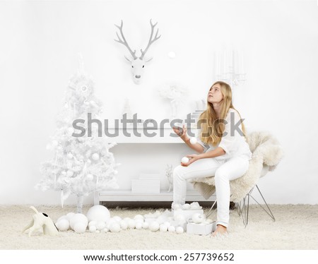 white christmas setting with girl waiting for the holidays to start