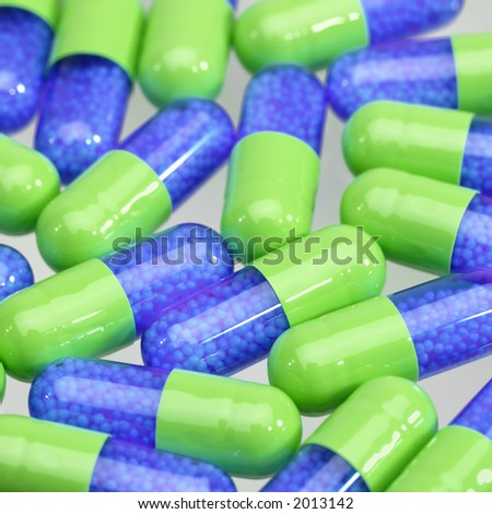 blue and green b blue and green pills filled with small white balls