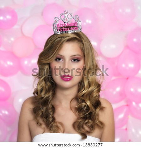 portrait of a young woman, crown on her head, surrounded by pink balloons