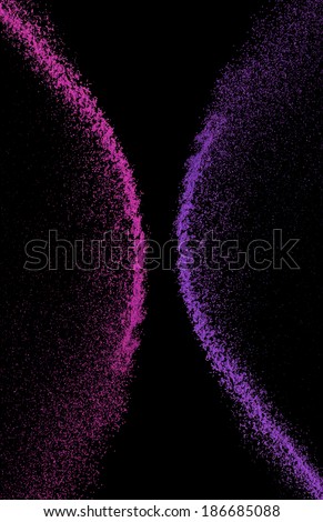 Mix makeup powder suspension pink and purple on black background.