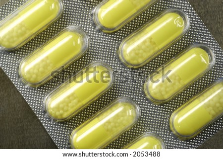 Capsule. Isolated capsule. Blister with capsules. Yelow Pills.