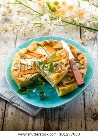 vegetables cake over dish on wood background