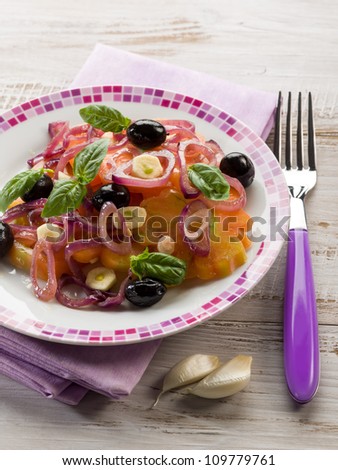 salad with ox heart tomatoes, onions olives and garlic