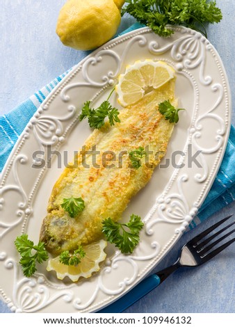 breaded sole fish with parsley and lemon