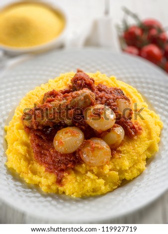 porridge with sausage and tomatoes sauce, selective focus