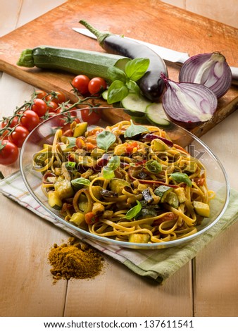 pasta with eggplants zucchinis tomatoes and curry
