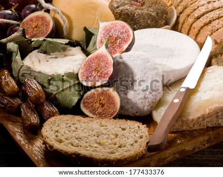 slice bread with an assortment of cheeses and fruits