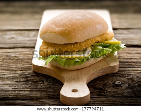 sandwich with breaded cutlet and lettuce