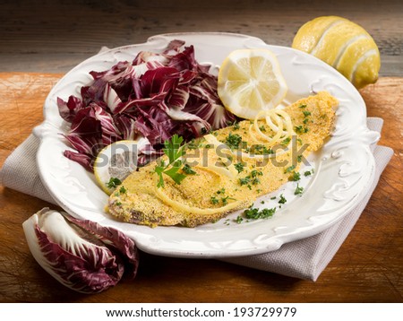 breaded sole with chicory salad and lemon