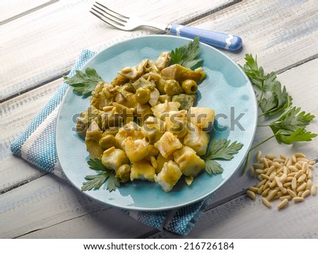 stewed fish with artichoke olives and pine nuts