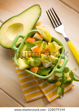 salad with avocado surimi and pineapple