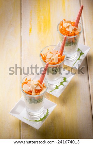 finger food with ricotta arugula carrot and sliced almond