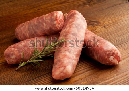 group of raw sausage and rosemary horizontal shoot