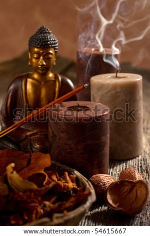 buddha with incense and candle