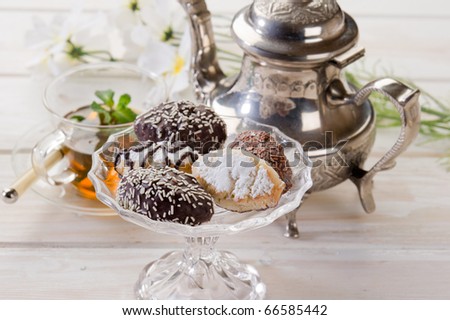 variety of biscuit over  bowl  and tea