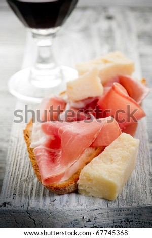 slice bread with parma ham  grana and wine